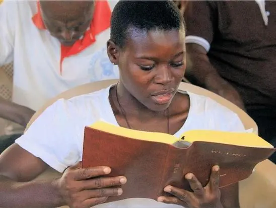 Reading the Kasem Bible1.jpg